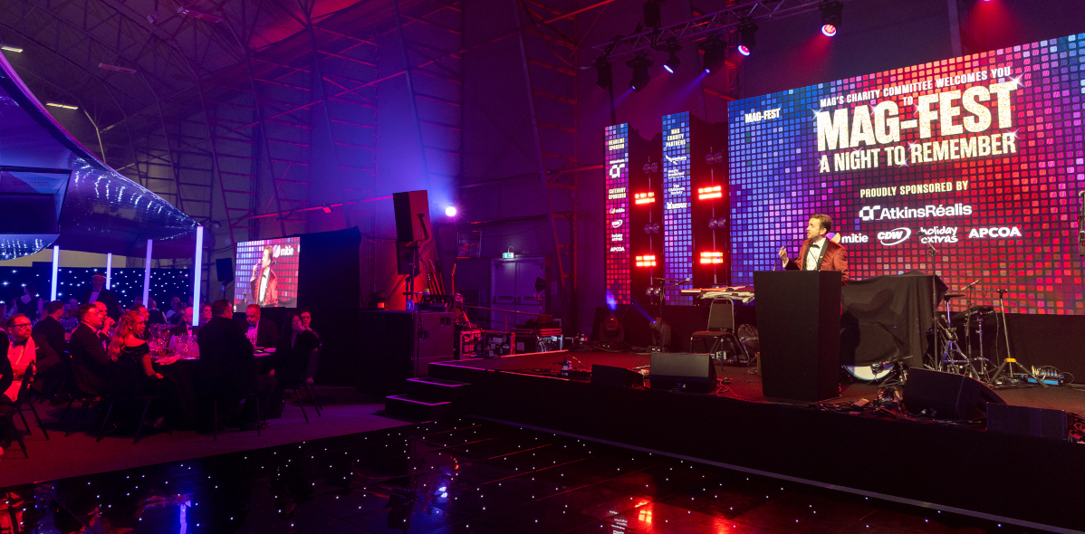 Kevin Durham hosting a conference on stage