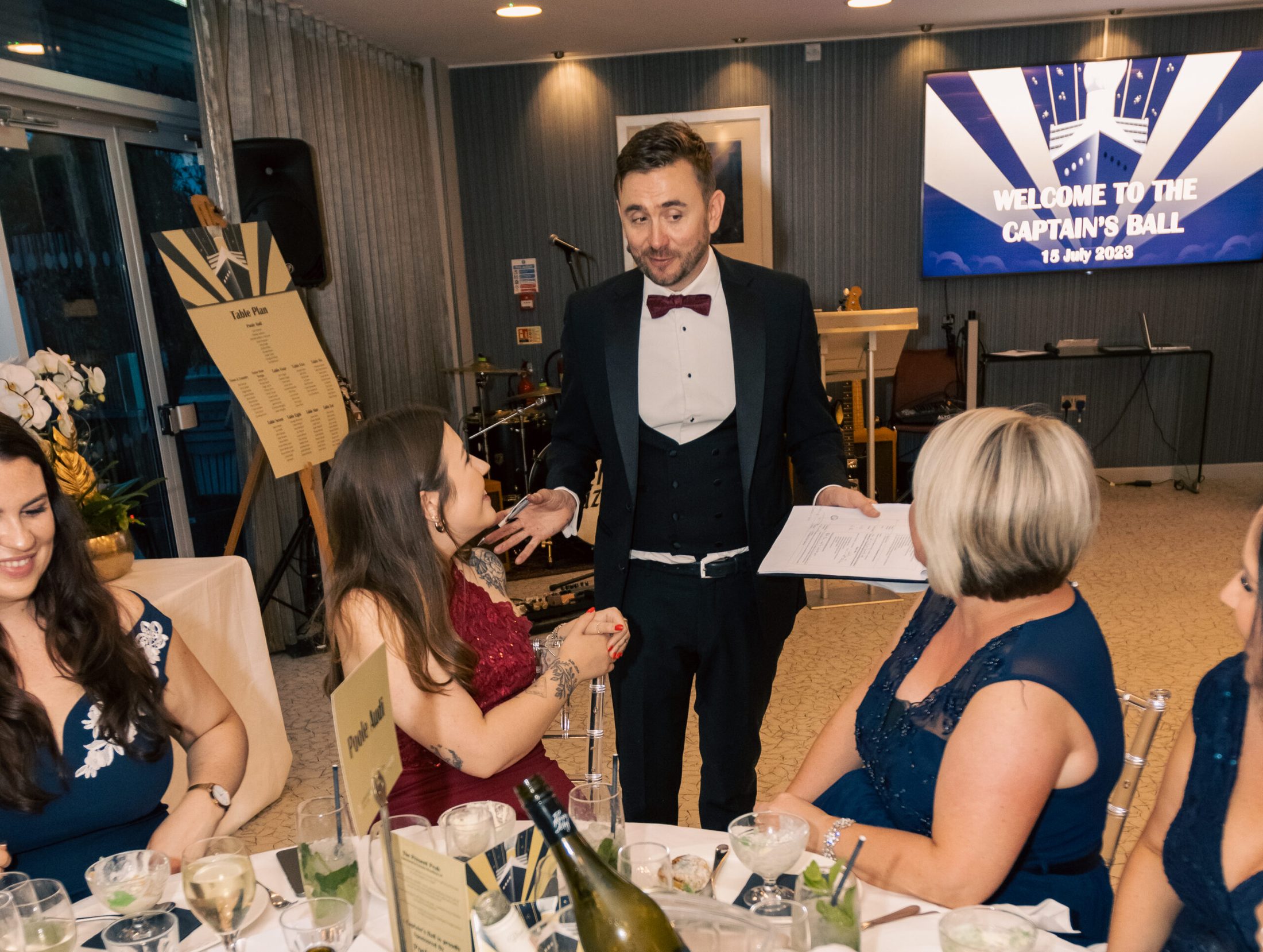 A live charity auction in full flow, the room bidding against each other. A live charity auction in full flow, the room bidding against each other.