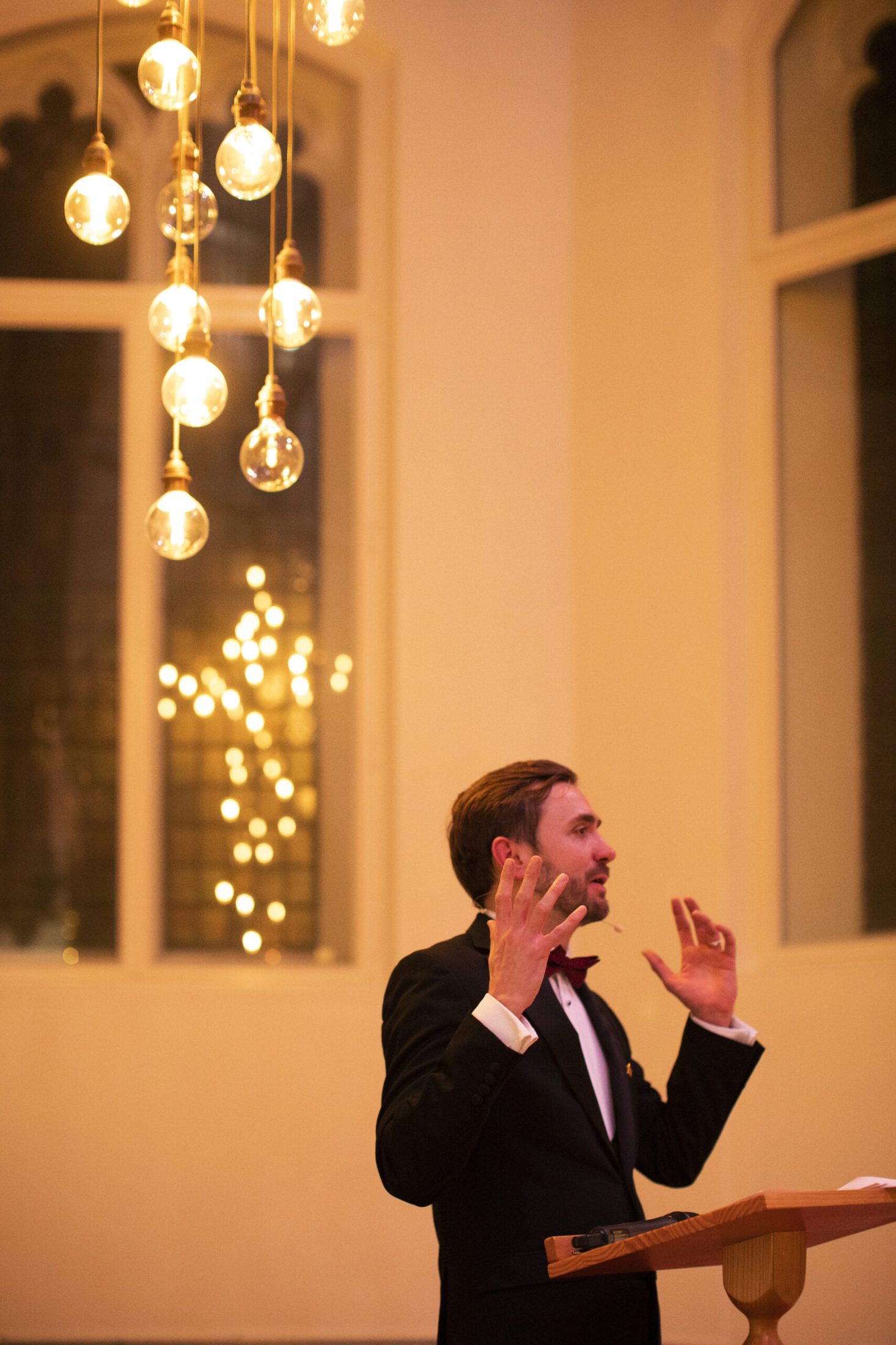 Charity auctioneer Kevin Durham hosting a black-tie charity fundraising gala, working the room during the live auction and pledge Charity auctioneer Kevin Durham hosting a black-tie charity fundraising gala, working the room during the live auction and pledge