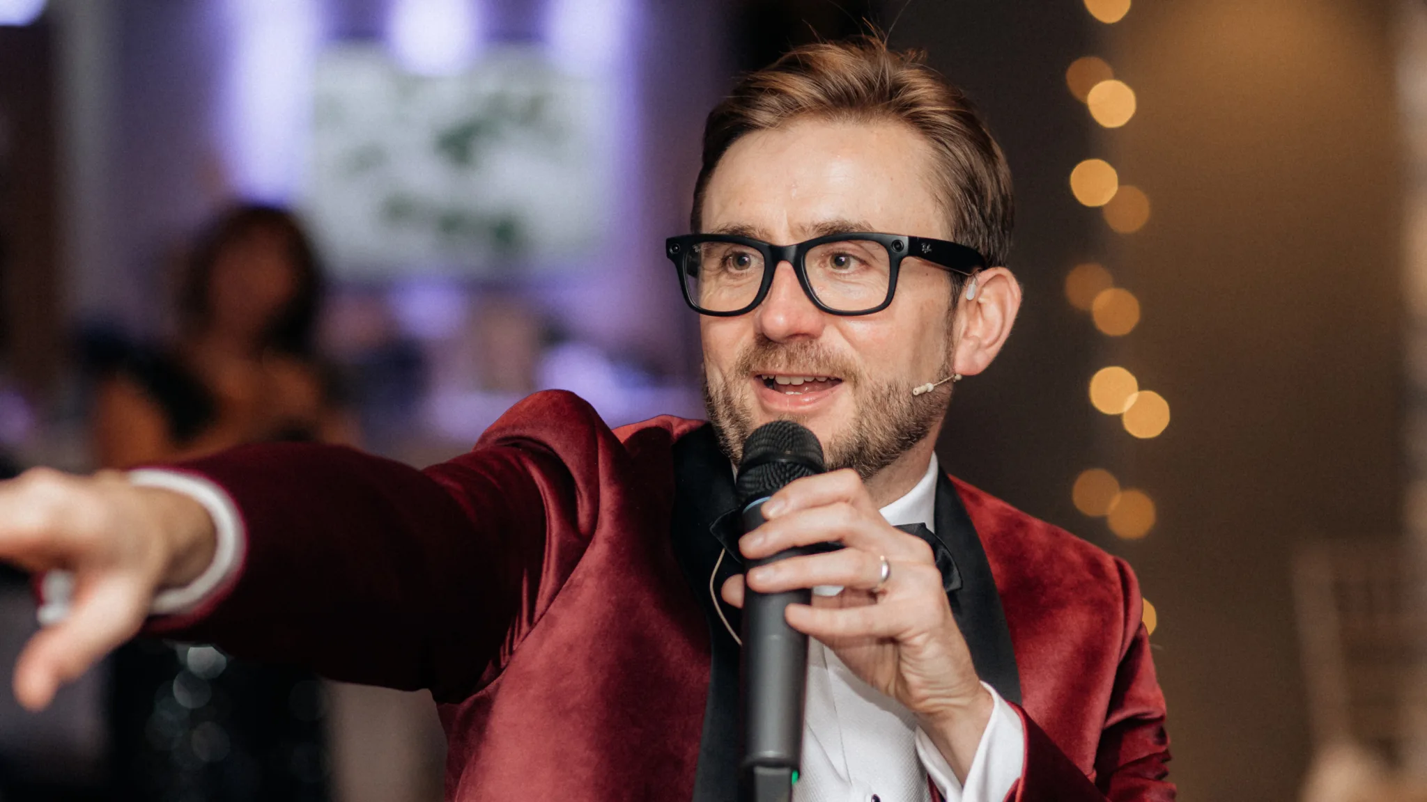 Kevin Durham speaking into a microphone and gesturing while running a live auction at the Jigsaw charity gala Kevin Durham speaking into a microphone and gesturing while running a live auction at the Jigsaw charity gala