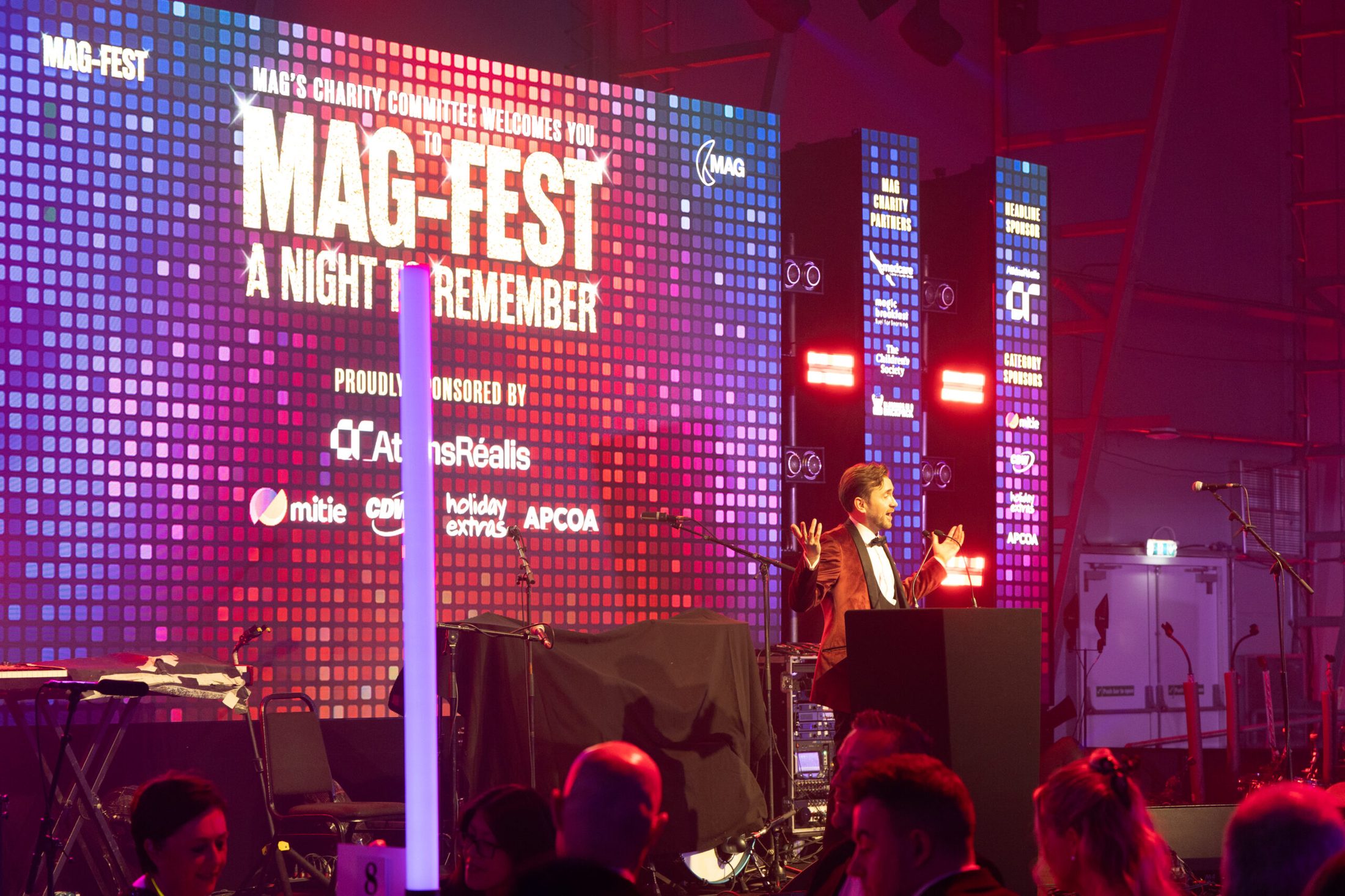 Charity auctioneer Kevin Durham hosting MAG-FEST, the Manchester Airport Group's charity gala, running the live auction and live pledge in aid of Medcare, Magic Breakfast, The Children's Society and Blessings in a Backpack.
